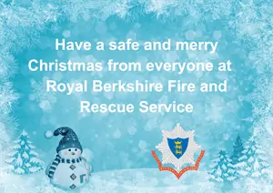 A snowy background with snowman, RBFRS logo, and text saying 'have a safe and merry Christmas from everyone at Royal Berkshire Fire and Rescue Service'