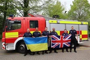 Firefighters driving vehicles to Ukraine