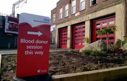 The front of caversham road fire station with a sign outside saying blood donor session this way