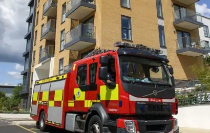 Fire appliance parked outside a multi-occupied residential building