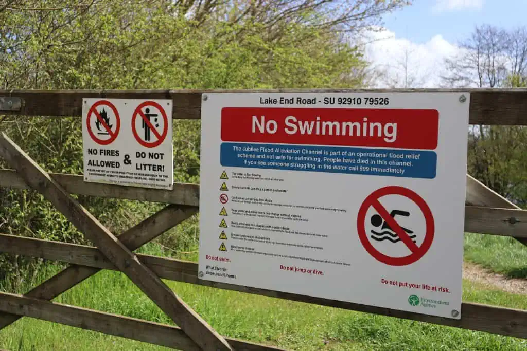 Water safety sign near river at Lake End Road