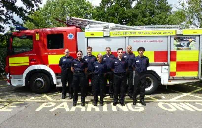 A group of Firefighter Apprentices stood in front of Fire Engine.