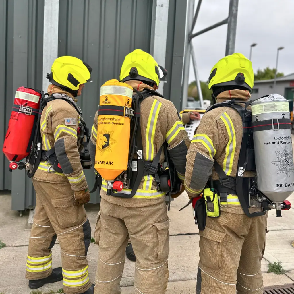 Firefighters from Berkshire, Buckinghamshire and Oxfordshire wearing breathing apparatus 