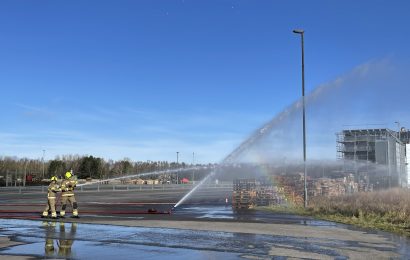 Firefighters spraying water during a training exercise