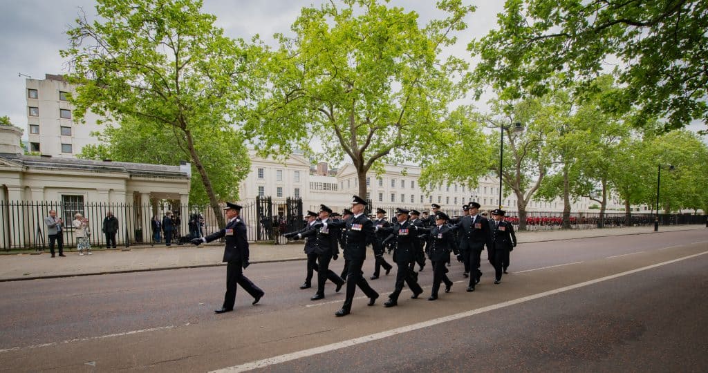 Chief Fire Officers in uniform marching