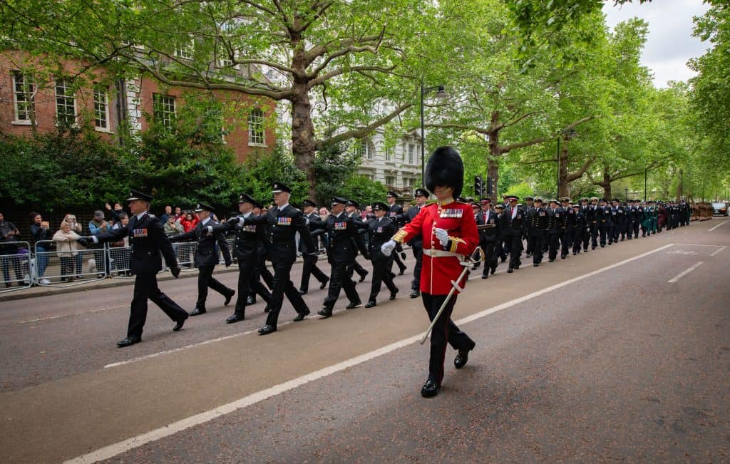 Chief Fire Officers marching next to a King's Guard