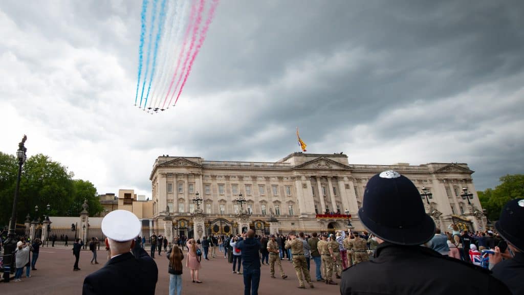 Blue, white and red flypast by the Armed Forces over Buckingham Palace