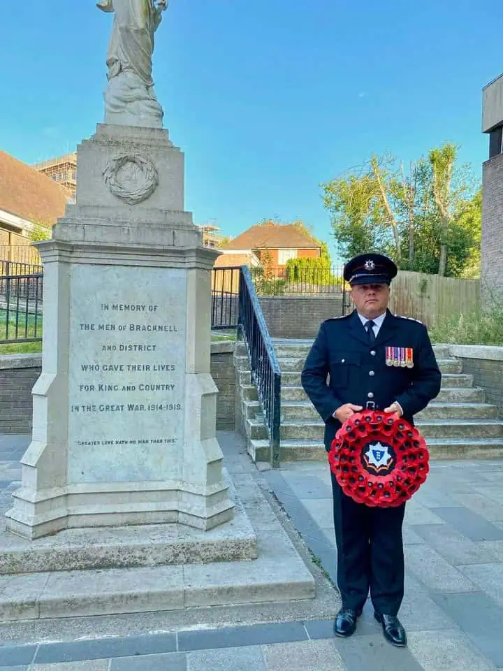 Station Manager Borham stood with an RBFRS poppy wreath next to the Bracknell War Memorial