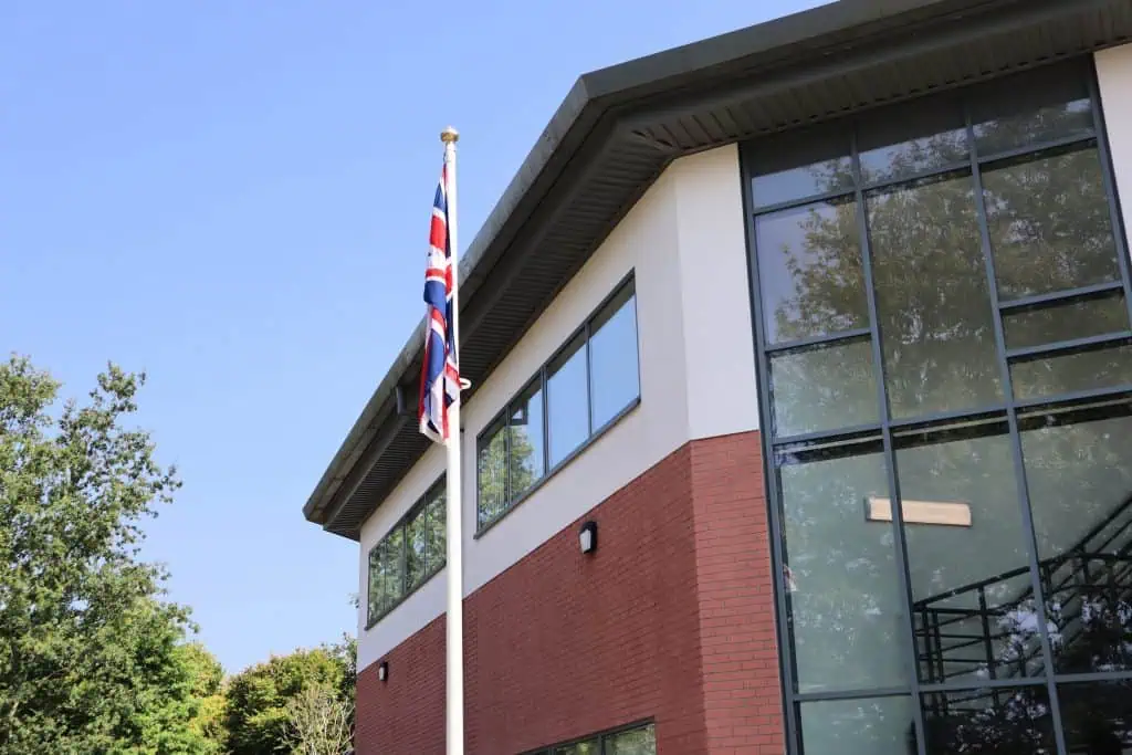 photo of the union flag flying at full-mast outside RBFRS HQ.