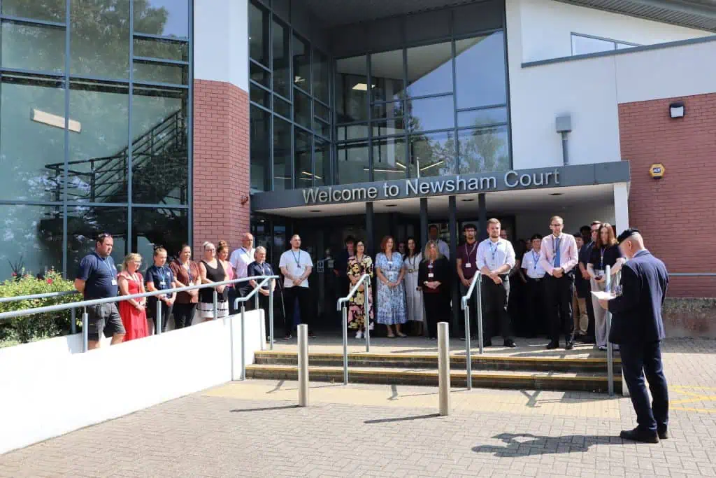 staff stood outside HQ during two minutes' silence