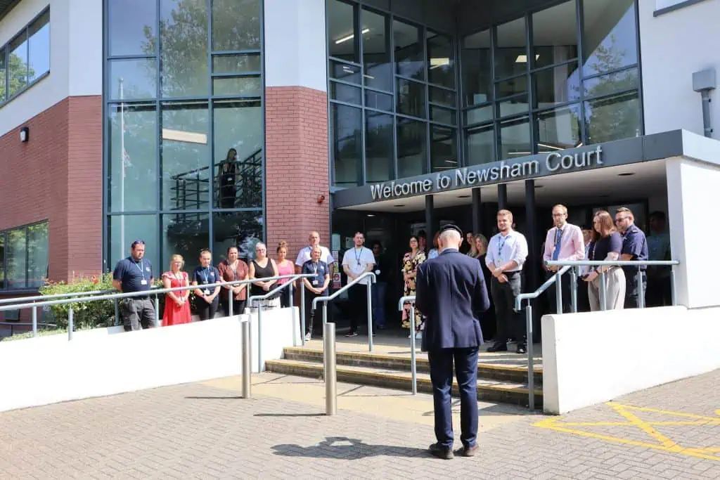 staff stood outside HQ during two minutes' silence