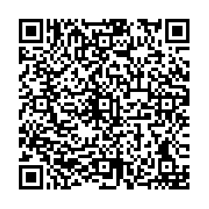 A QR Code that links to the school booking form.