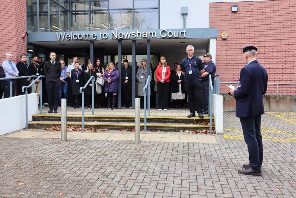 Staff line up outisde the front of Headquarters
