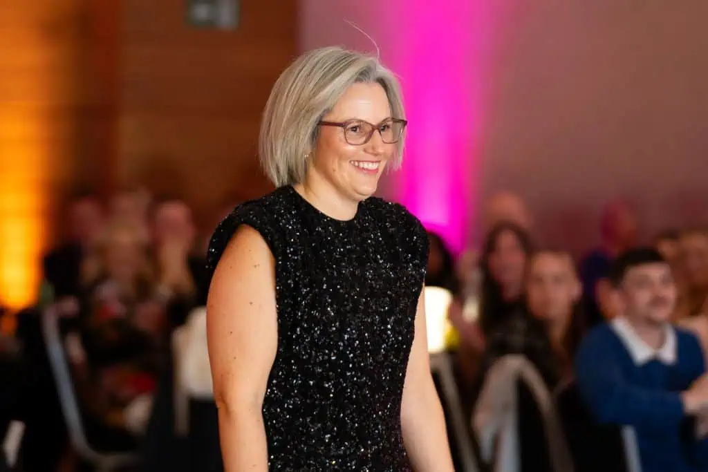 A women approaches the stage during the ceremony
