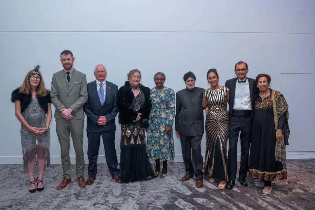 Sandy and other award winners stood smiling in a group photo