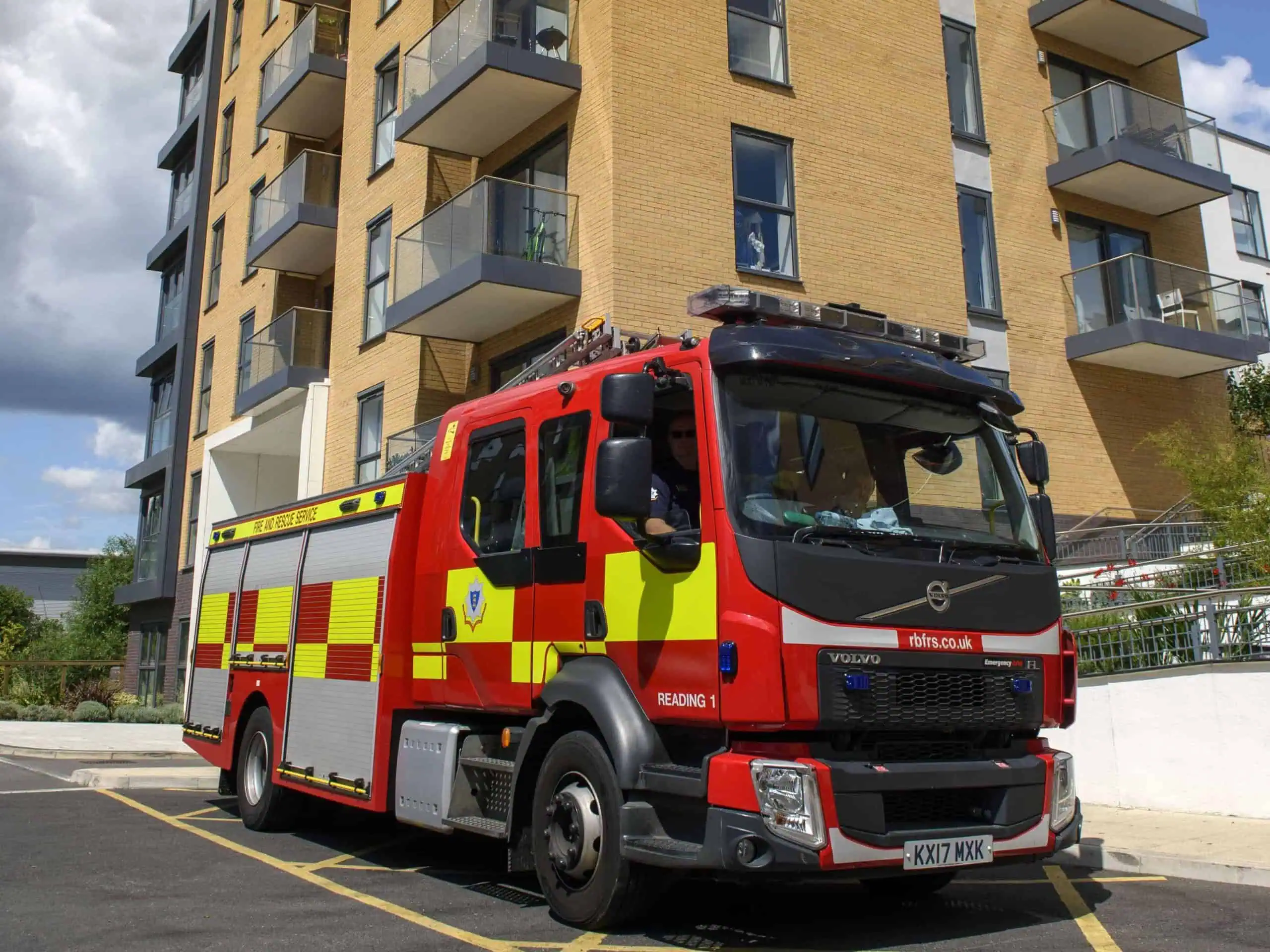 Fire appliance parked outside a multi-occupied residential building