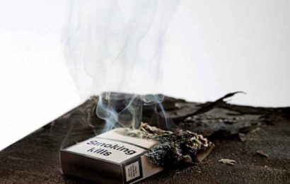 a burnt cigarette box with smoke