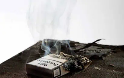 a burnt cigarette box with smoke