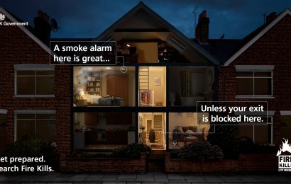 Smoke alarm warning in residential property during fire emergency.