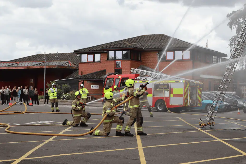 Firefighters during a hose reel drill